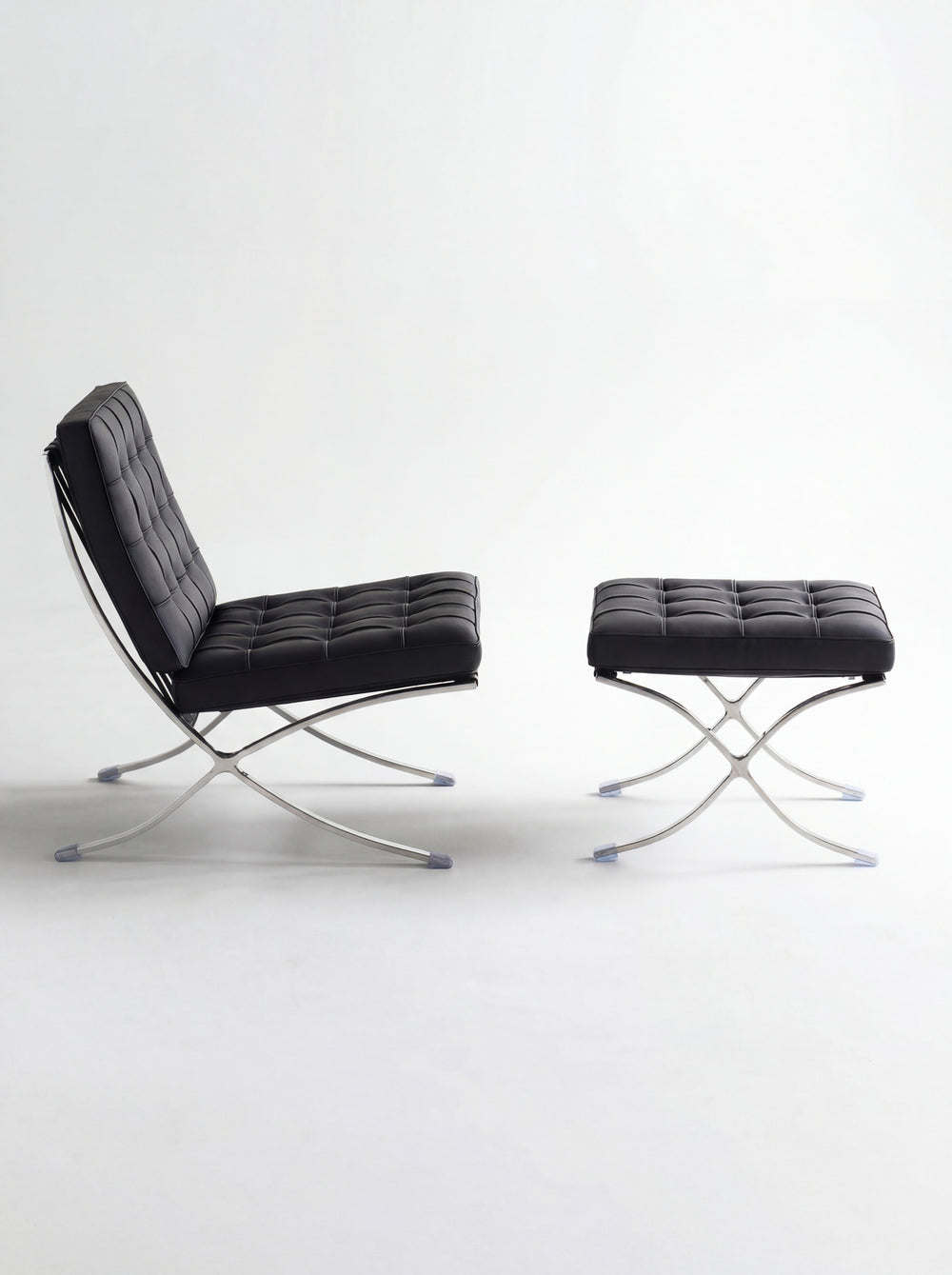 Lounge Chair &amp; Footstool – Black Genuine Leather &amp; Sculptural Chrome Frame